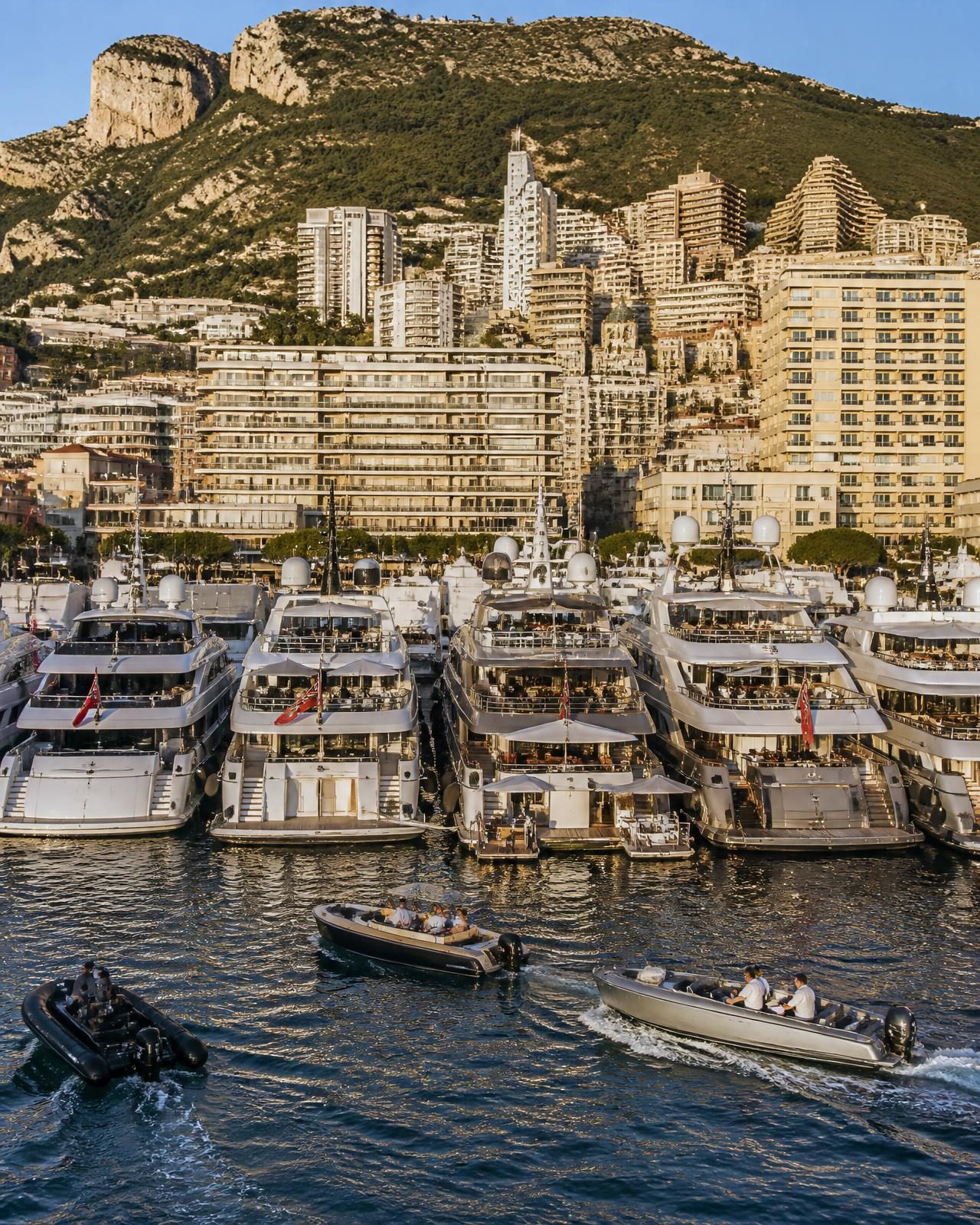 Superyachts moored stern-to in Port Hercule below Monte-Carlo